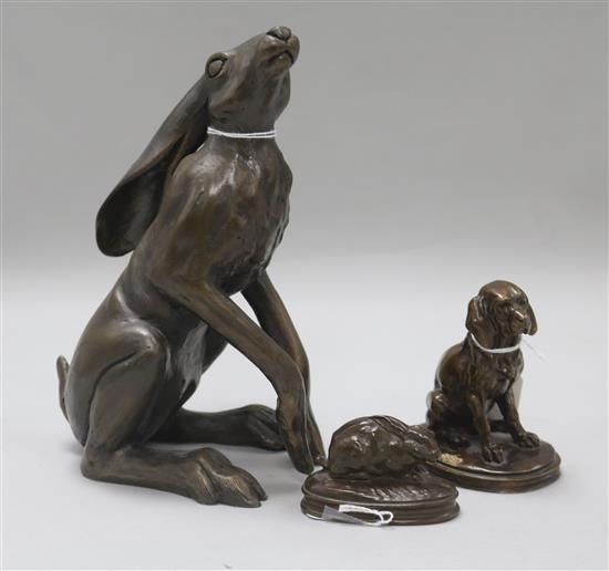 After Jacquemart, bronze, Basset Assis, a small bronze model of a rabbit after Barye and a bronze-effect model of a seated hare